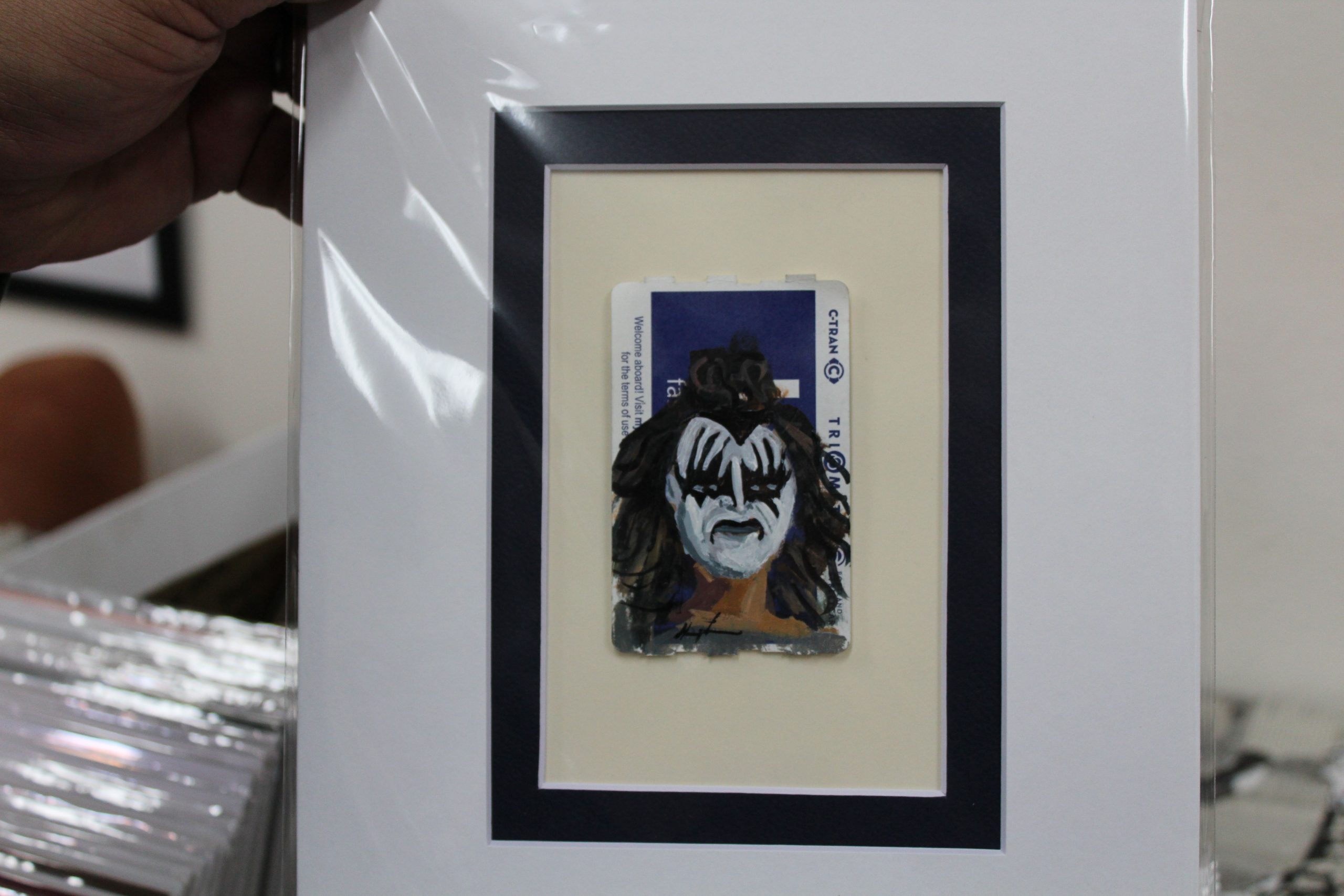 Painting of Gene Simmons of KISS painted on a TriMet ticket